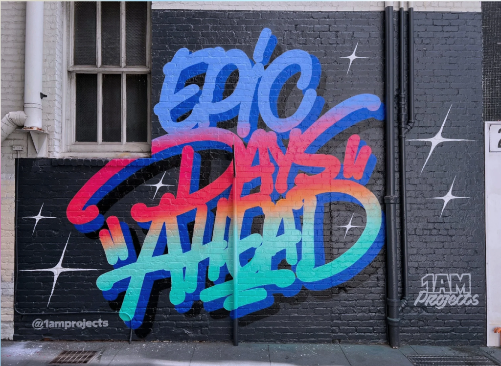 Vibrant Mural in blue red teal " Epic Days Ahead" by 1am Projects