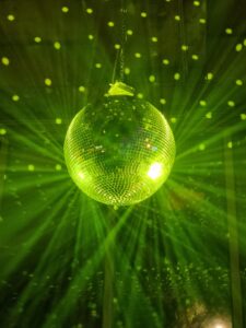 disco ball surrounding by green lighting