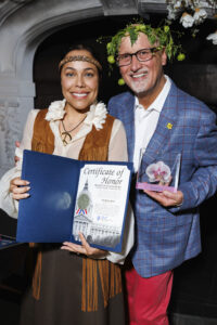 Marisa Rodriguez and Brian Fenwick hold the Bloomie Award for Best Cocktail, awarded to Tratto