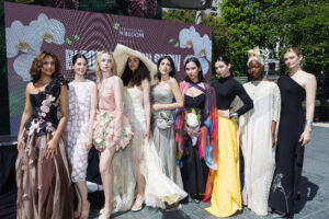 Nine models pose in the Academy of Art student-designed Bloom dresses as a part of the Bloom Fashion Show in collaboration with the With Love Halston Foundation